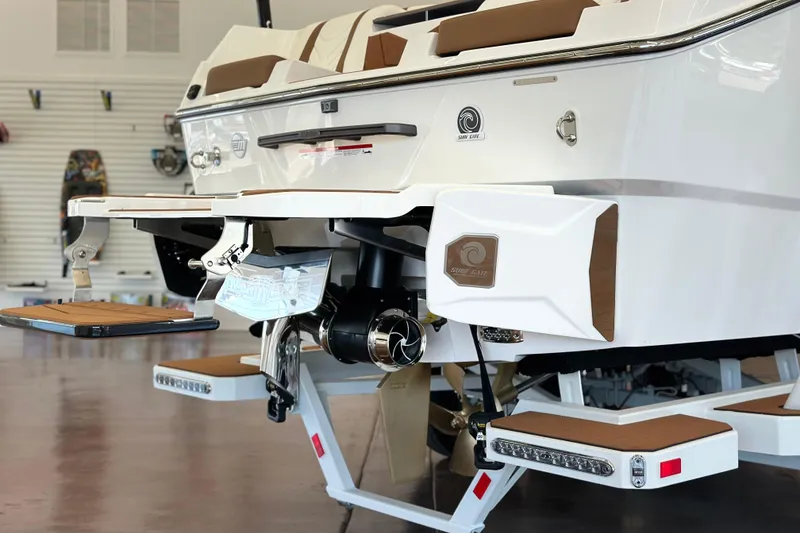 Slide: The Image of 2026 Malibu Wakesetter 25 LSV boat rear view with surf gate and swim platform. - 7
