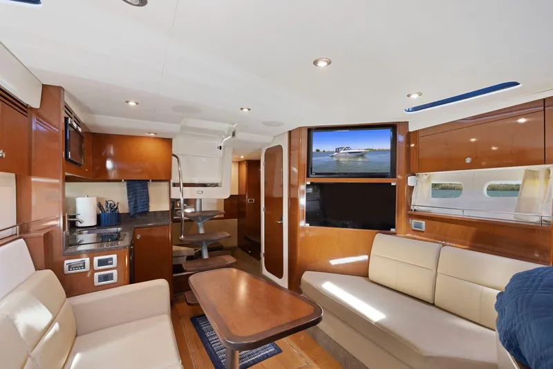 Slide: The Image of Luxurious interior of 2014 Sea Ray 350 Sundancer yacht with modern amenities and elegant design. - 23