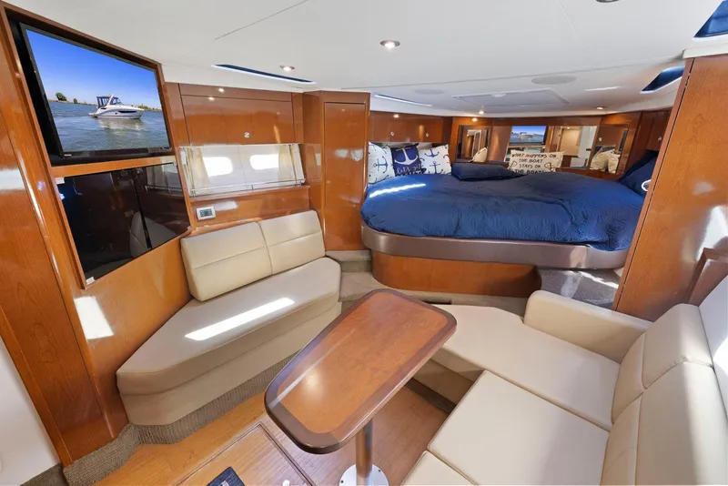 Slide: The Image of Luxurious interior of 2014 Sea Ray 350 Sundancer yacht with seating and bed. - 26