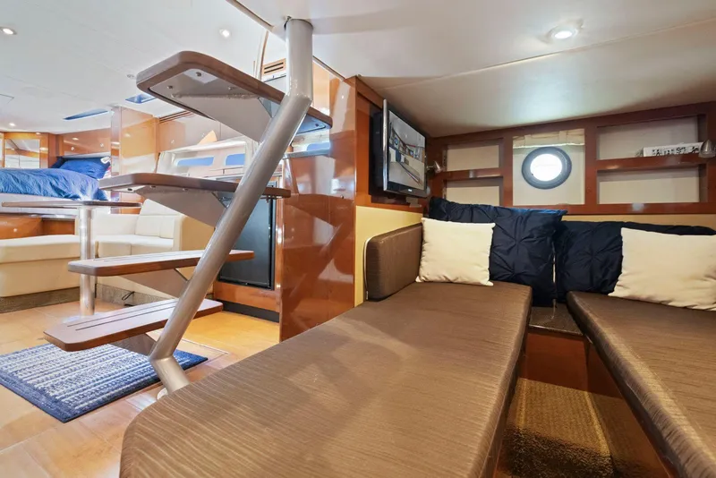 Slide: The Image of Interior of 2014 Sea Ray 350 Sundancer yacht, featuring cozy seating and modern design. - 28