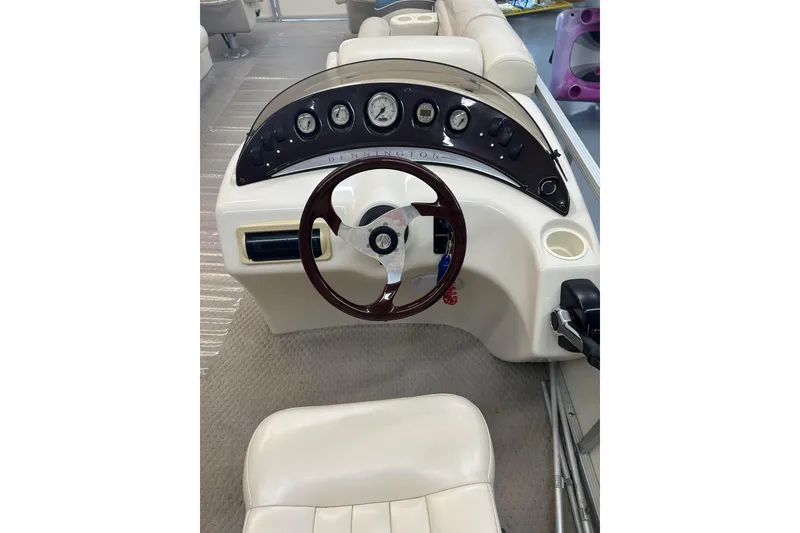 Slide: The Image of 2005 Bennington 2250RFS boat dashboard with steering wheel and instrument panel. - 5