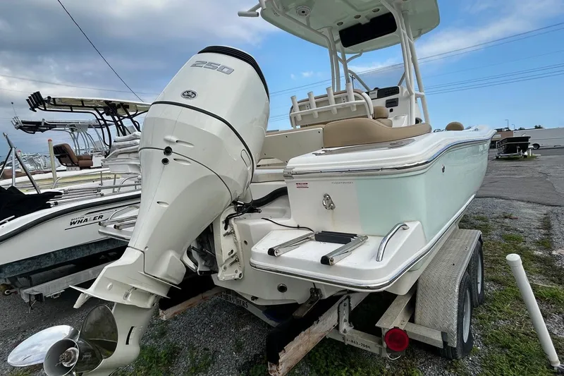 Slide: The Image of 2021 Pioneer 222 Islander boat on trailer with powerful outboard motor. - 10