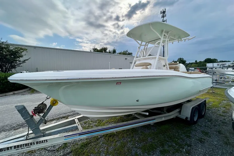 Slide: The Image of 2021 Pioneer 222 Islander boat on trailer under cloudy sky. - 3