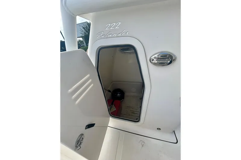 Slide: The Image of Open storage compartment on 2021 Pioneer 222 Islander boat. - 7