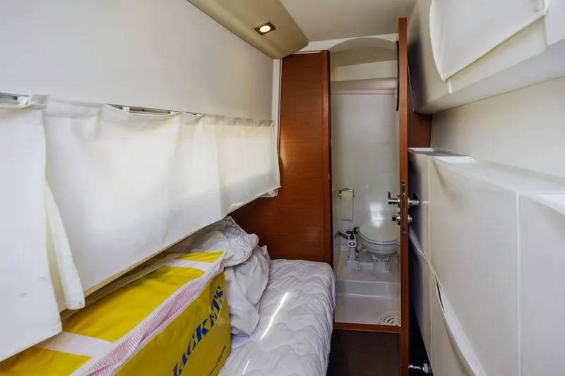 Slide: The Image of Compact cabin interior of 2015 Prestige 500FB yacht with bed and bathroom. - 16