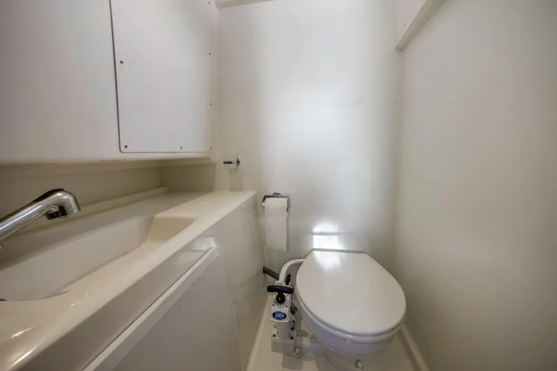 Slide: The Image of Compact bathroom in 2015 Prestige 500FB yacht with toilet and sink. - 17