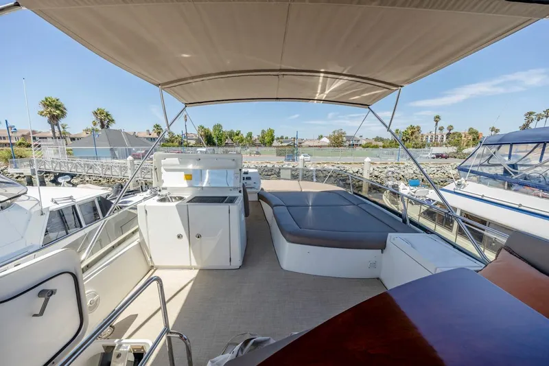 Slide: The Image of Spacious deck of 2015 Prestige 500FB yacht with seating and kitchenette. - 21