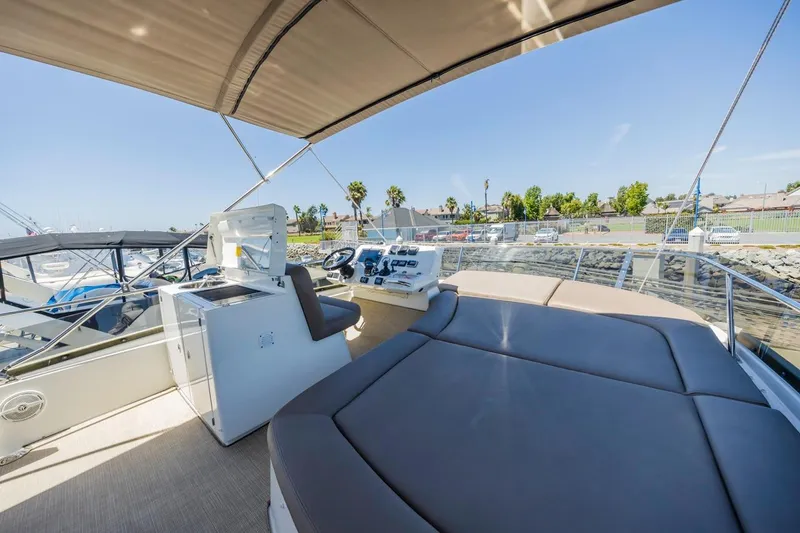 Slide: The Image of Flybridge of 2015 Prestige 500FB yacht with helm station and sunbathing area. - 24