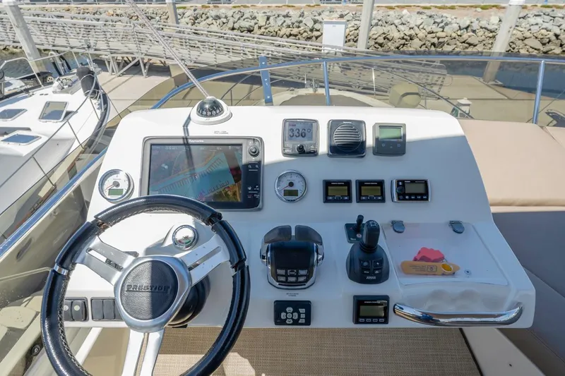 Slide: The Image of Control panel of a 2015 Prestige 500FB yacht with navigation instruments. - 3