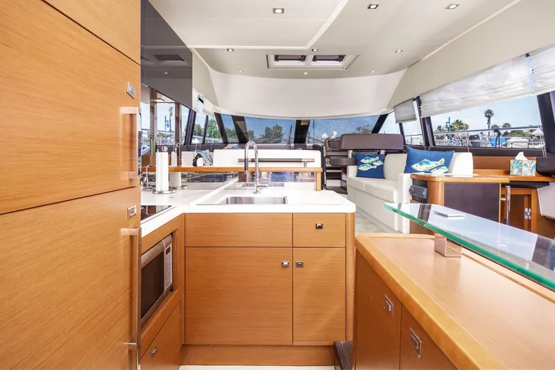 Slide: The Image of Luxurious interior of 2015 Prestige 500FB yacht with modern kitchen and spacious seating area. - 31