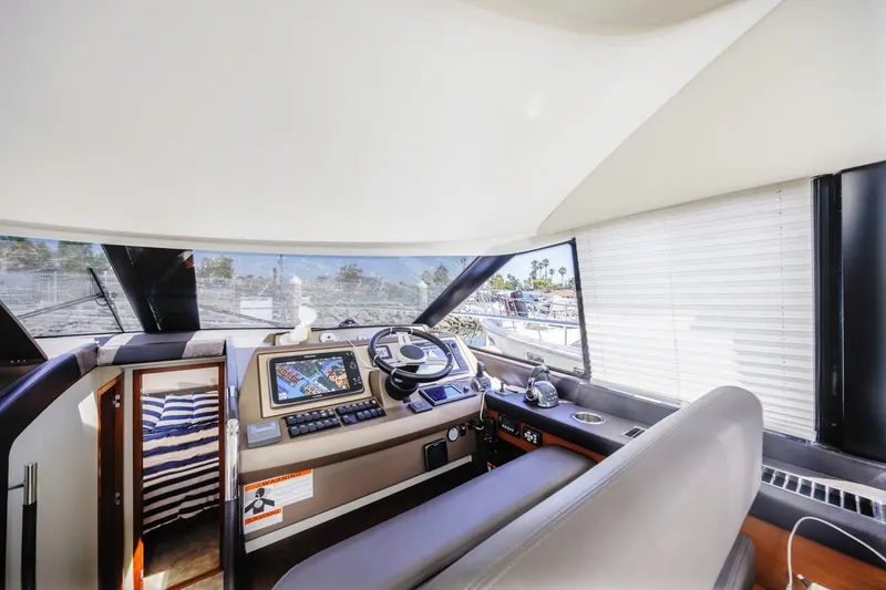 Slide: The Image of Interior of 2015 Prestige 500FB yacht cockpit with modern navigation equipment. - 4