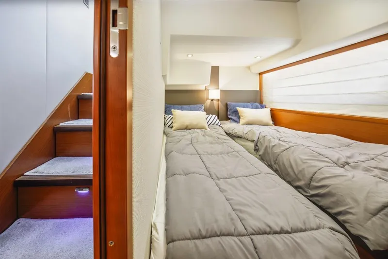 Slide: The Image of Twin beds in a cozy cabin of a 2015 Prestige 500FB yacht. - 41
