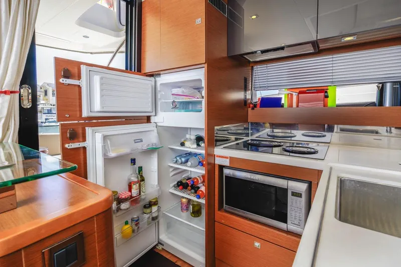 Slide: The Image of Modern kitchen in 2015 Prestige 500FB yacht with open fridge and microwave. - 46
