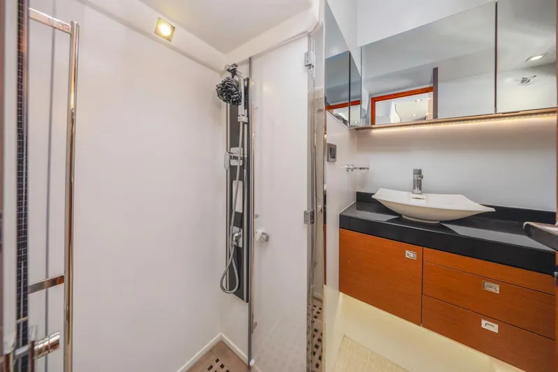 Slide: The Image of Luxurious bathroom in 2015 Prestige 500FB yacht with modern fixtures and elegant design. - 50