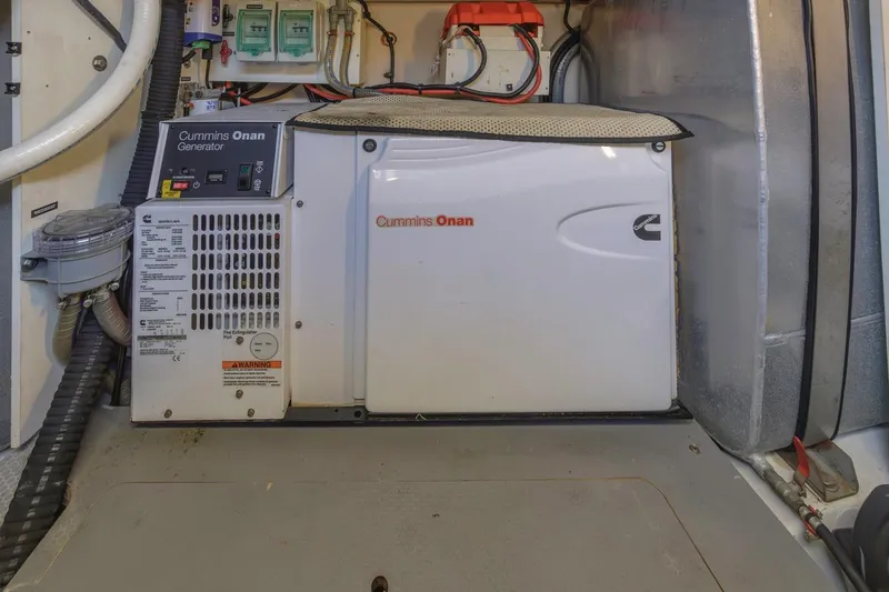 Slide: The Image of Cummins Onan generator in a 2015 Prestige 500FB yacht engine room. - 54