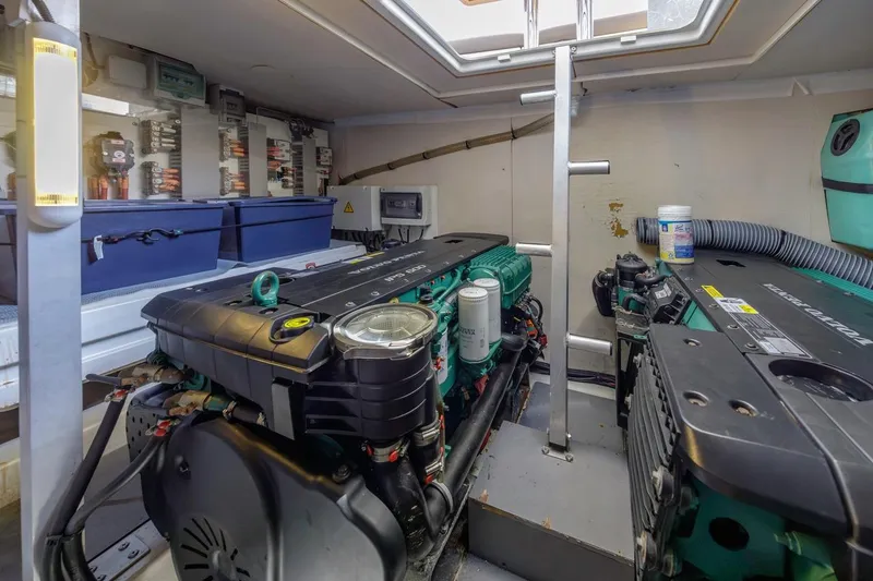 Slide: The Image of Engine room of a 2015 Prestige 500FB yacht, featuring dual engines and control systems. - 57