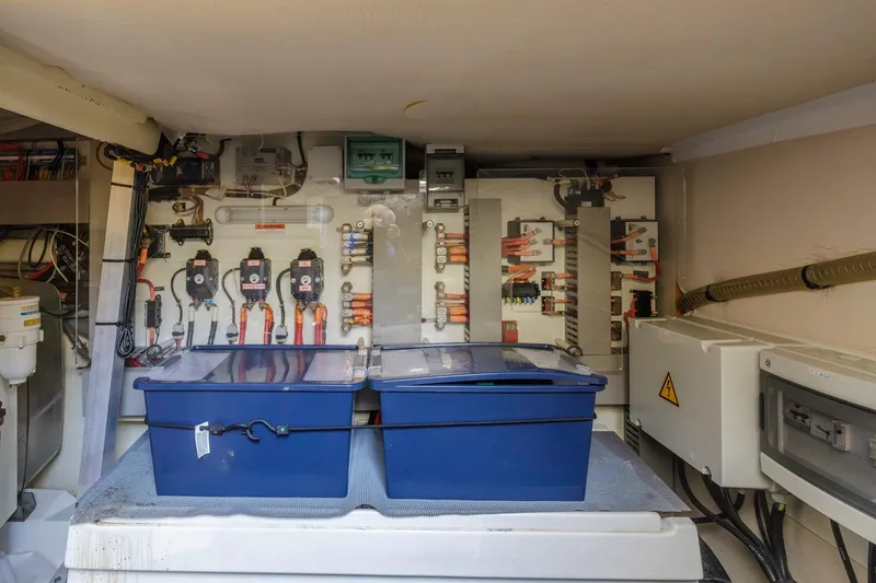 Slide: The Image of Electrical system of a 2015 Prestige 500FB yacht, featuring organized wiring and control panels. - 58