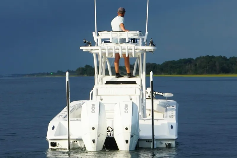 Slide: The Image of 2022 SeaHunter 28 Floridian boat on calm water, viewed from the rear. - 4