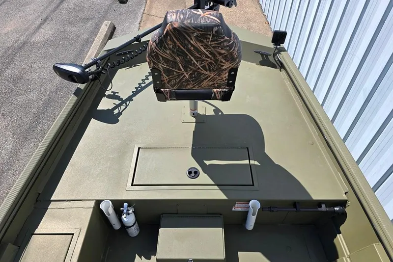 Slide: The Image of 2022 Lowe Roughneck RX1860 Rambler boat interior with camo seat and storage compartments. - 4