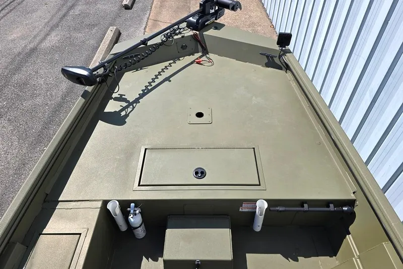 Slide: The Image of 2022 Lowe Roughneck RX1860 Rambler boat deck with trolling motor and storage compartments. - 5