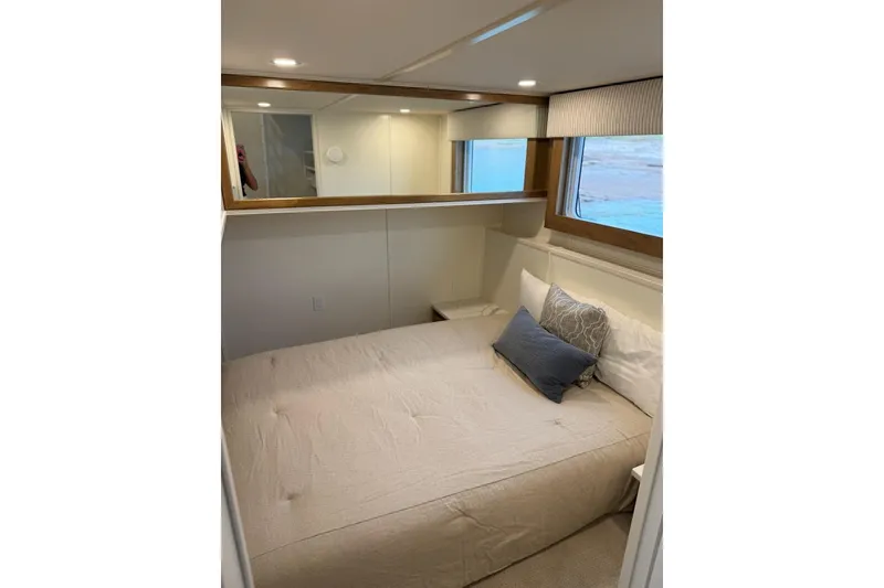 Slide: The Image of Cozy bedroom in 2025 Sumerset Excellence Multiple Shares houseboat, featuring modern decor and window view. - 13