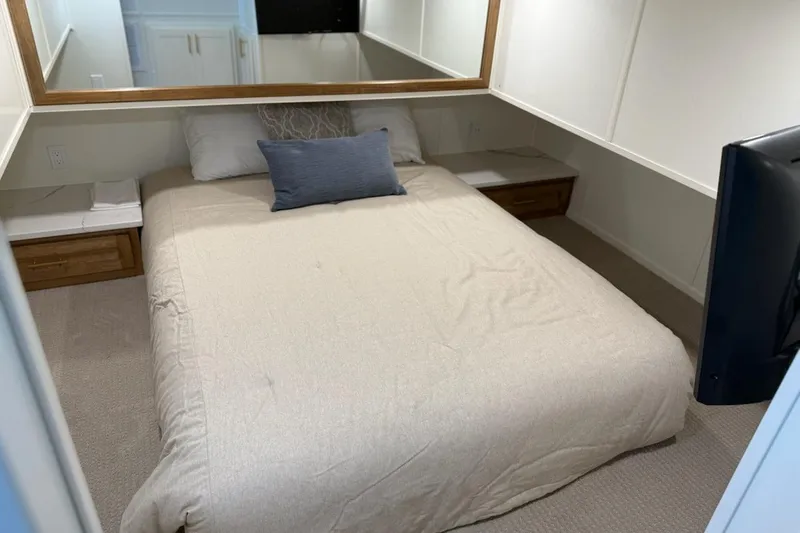 Slide: The Image of Cozy bedroom in 2025 Sumerset Excellence Multiple Shares houseboat, featuring a comfortable bed and modern decor. - 15