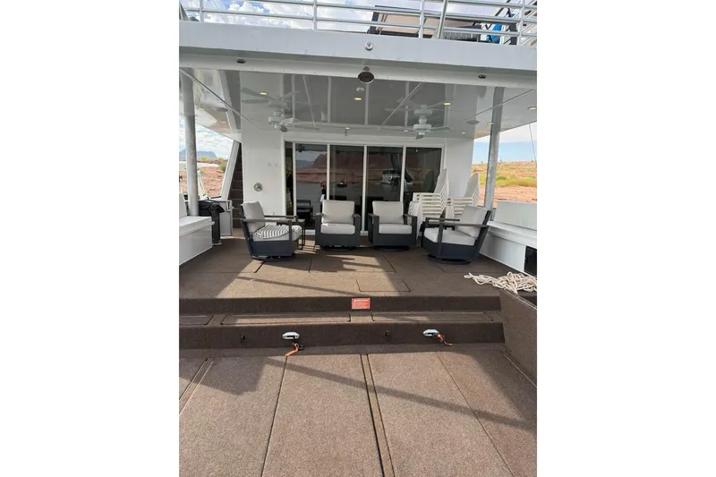 Slide: The Image of Luxury Sumerset Excellence Multiple Shares 2025 houseboat with outdoor seating area and modern design. - 21