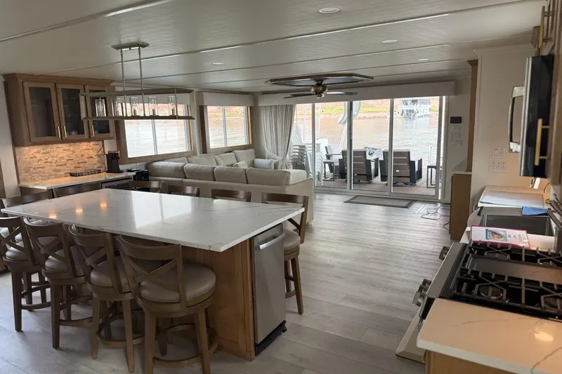 Slide: The Image of Luxurious 2025 Sumerset Excellence houseboat interior with modern kitchen and spacious living area. - 26