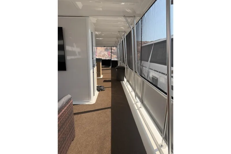 Slide: The Image of Interior view of 2025 Sumerset Excellence Multiple Shares houseboat with spacious walkway. - 6