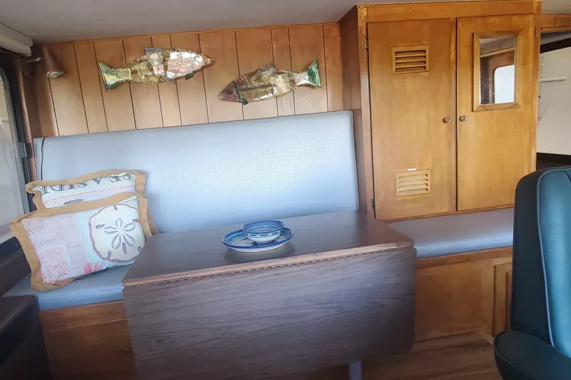 Slide: The Image of Interior of 1965 Tacoma Boat Works Bill Garden Motor Yacht with wooden paneling and decor. - 13