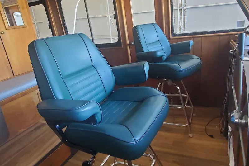 Slide: The Image of Interior of 1965 Tacoma Boat Works Bill Garden Motor Yacht with blue captain chairs. - 14
