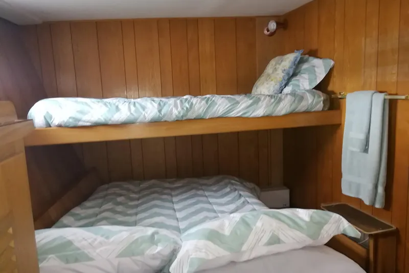 Slide: The Image of Cozy wooden cabin with bunk beds on 1965 Tacoma Boat Works Bill Garden Motor Yacht. - 24