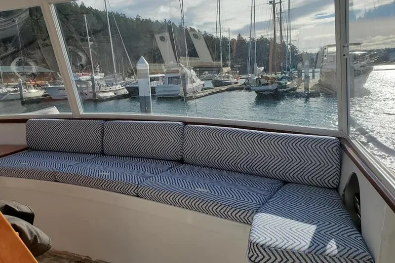 Slide: The Image of Interior view of 1965 Tacoma Boat Works Bill Garden Motor Yacht with marina backdrop. - 27