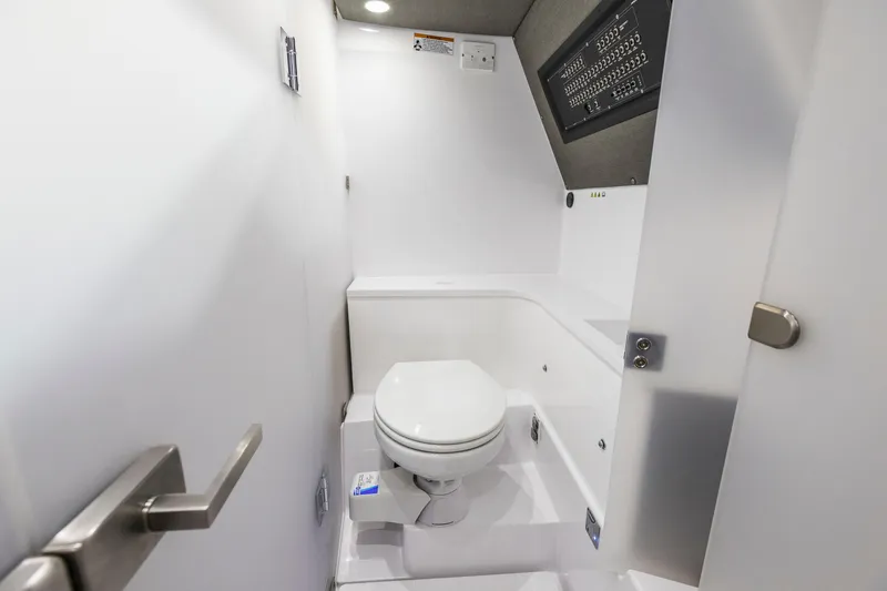 Slide: The Image of 2025 Axopar 37XC CROSS CABIN BRABUS Trim bathroom interior with modern white design. - 7