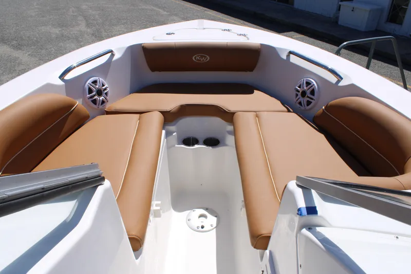 Slide: The Image of 2026 Key West 203 DFS boat interior with tan seating and speakers. - 12