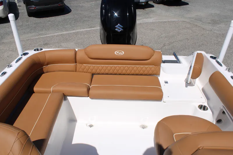 Slide: The Image of 2026 Key West 203 DFS boat interior with tan leather seating and modern design. - 15