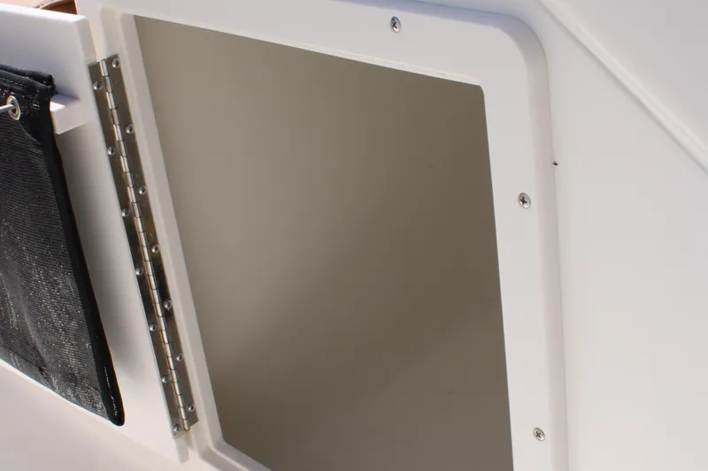 Slide: The Image of Open storage compartment on 2026 Key West 203 DFS boat. - 20