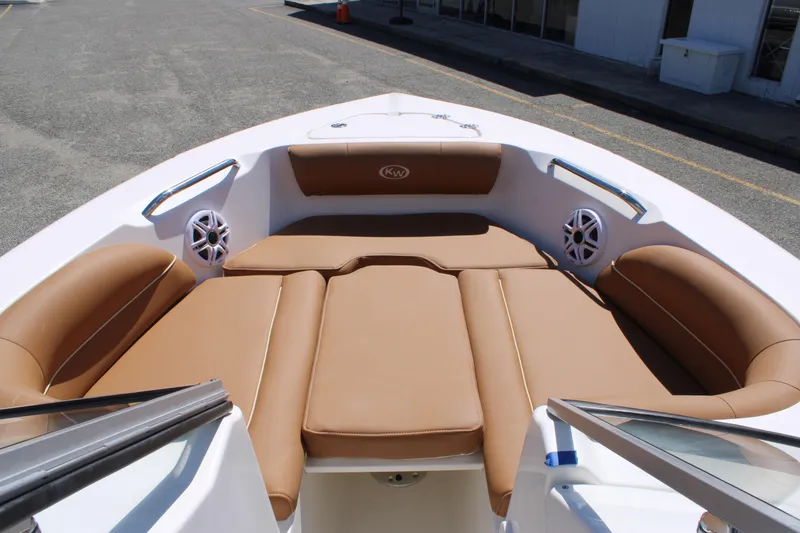 Slide: The Image of 2026 Key West 203 DFS boat interior with tan seating and speakers. - 23