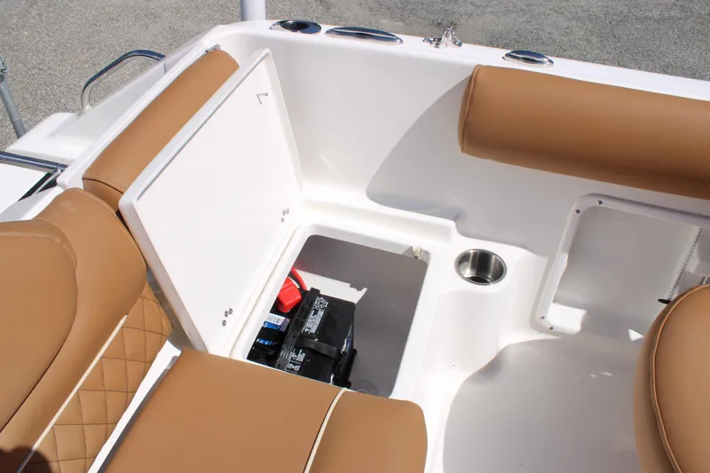 Slide: The Image of 2026 Key West 203 DFS boat interior with tan seating and storage compartment. - 25