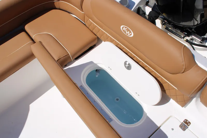 Slide: The Image of 2026 Key West 203 DFS boat interior with tan seating and livewell. - 26