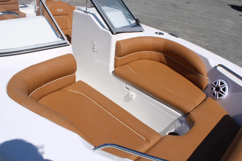 Slide: The Image of 2026 Key West 203 DFS boat interior with tan seating and white accents. - 9