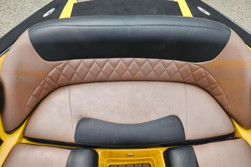 Slide: The Image of 2006 MasterCraft MariStar 200 boat interior with tan seating and sleek design. - 13