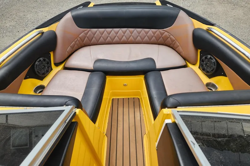 Slide: The Image of 2006 MasterCraft MariStar 200 wakeboard tower near a serene riverbank. - 15