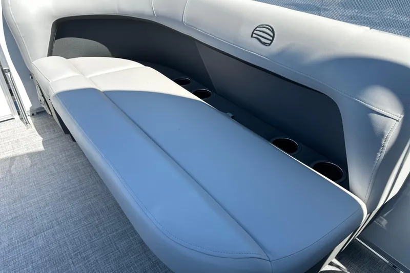 Slide: The Image of 2026 Sun Tracker Party Barge 16 DLX interior seating with cup holders. - 10