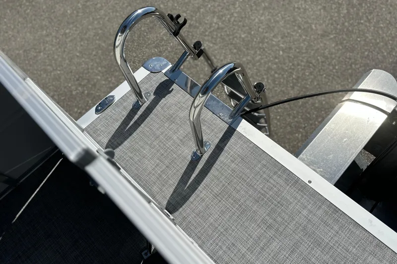 Slide: The Image of Sun Tracker Party Barge 16 DLX 2026, rear deck with ladder, top view. - 15