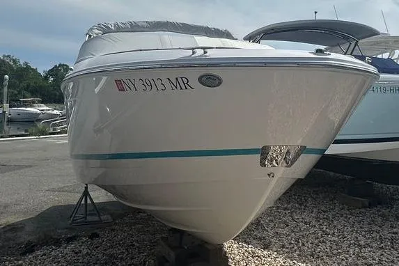 Slide: The Image of 2020 Regal LS4 boat on dry dock, white hull, registration NY 3913 MR. - 13