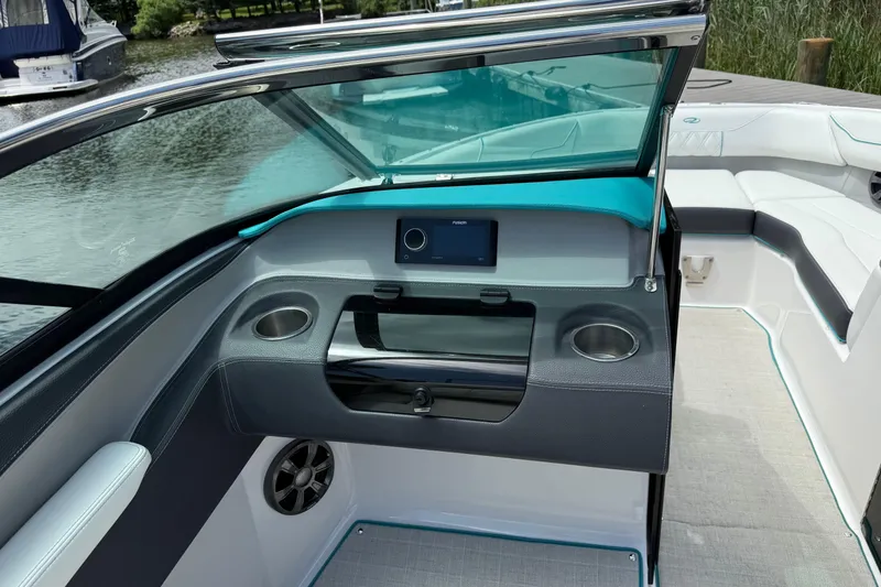 Slide: The Image of Interior of 2020 Regal LS4 boat with modern dashboard and cup holders. - 9