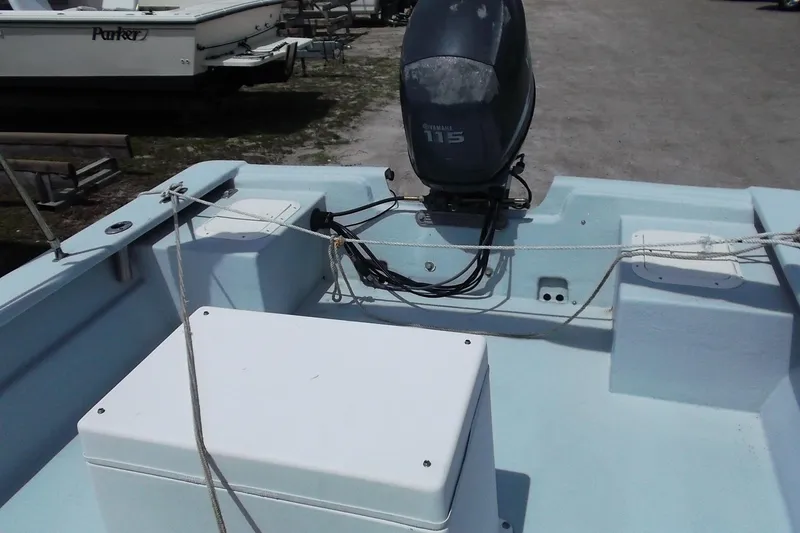 Slide: The Image of 2008 Hancock 22 boat with Yamaha 115 outboard motor, docked on a sunny day. - 8