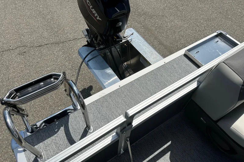 Slide: The Image of 2026 Sun Tracker Bass Buggy 16 DLX pontoon boat with Mercury outboard motor. - 13