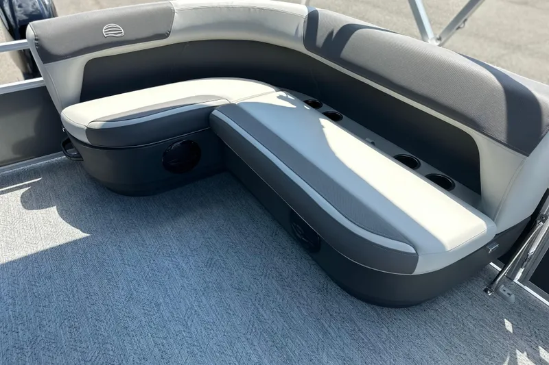 Slide: The Image of 2026 Sun Tracker Bass Buggy 16 DLX pontoon boat seating area with cup holders. - 9